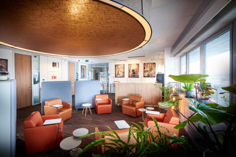 Modern office space with comfortable seating and games.